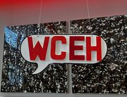 Sign hanging in the shape of a speech bubble that reads “WCEH”, which is short for “WordCamp Eh?”