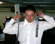 Derick Fage ties his tie
